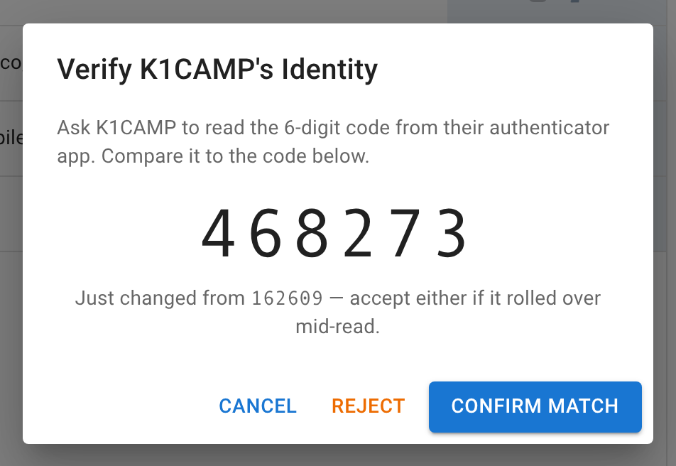 The Verify K1CAMP's Identity dialog, showing the station's current six-digit code and the one before it, with Cancel, Reject, and Confirm Match buttons.