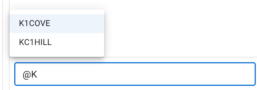 The chat composer containing the text '@K', with an autocomplete list open above it offering K1COVE and KC1HILL.